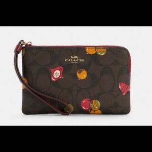 Signature coated canvas smooth leather
credit card slots
Zip-top closure, 
L